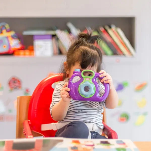 Parent and child at a Houston daycare classroom door